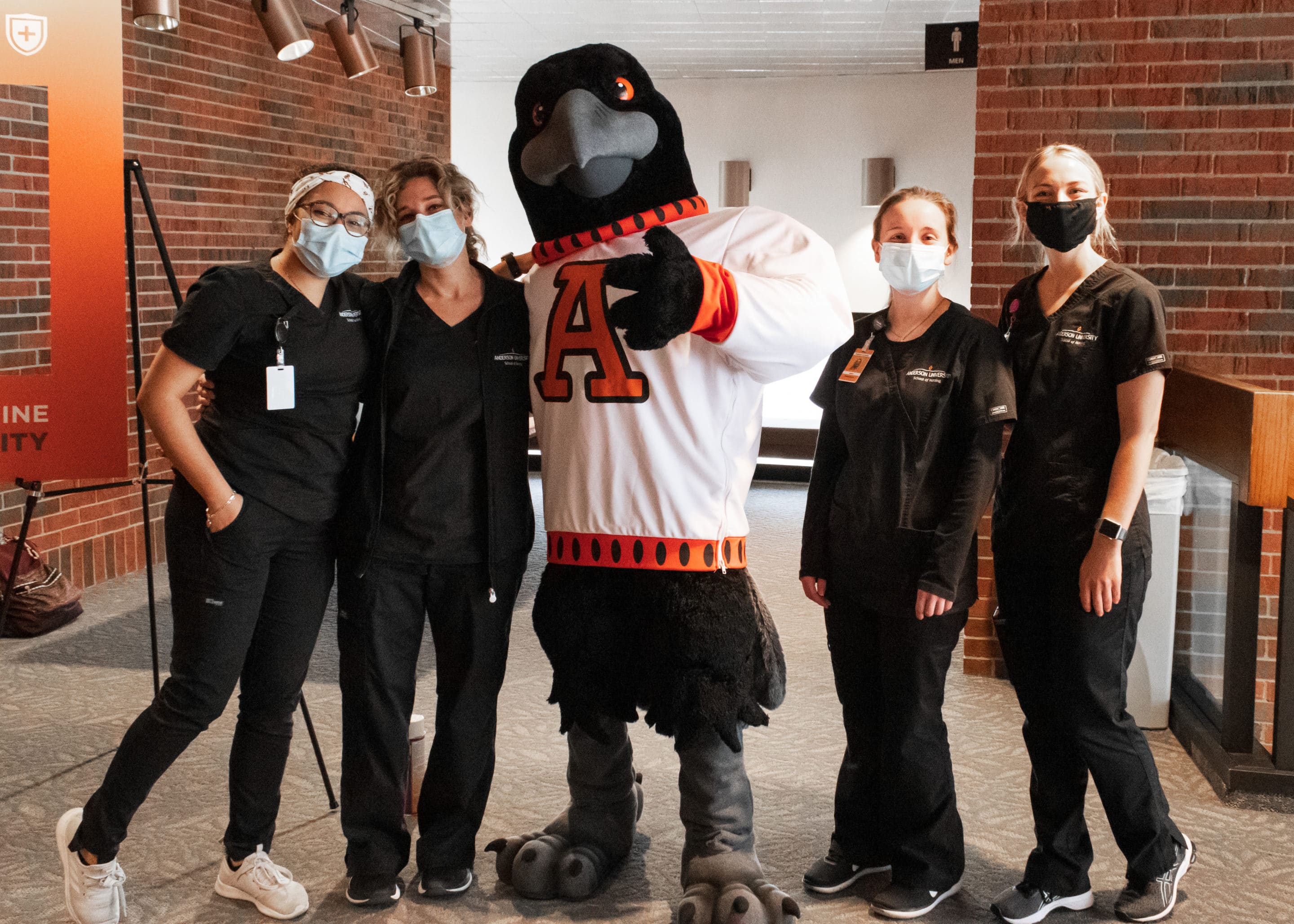 Nursing students and mascot at COVID vaccine clinic at Anderson University