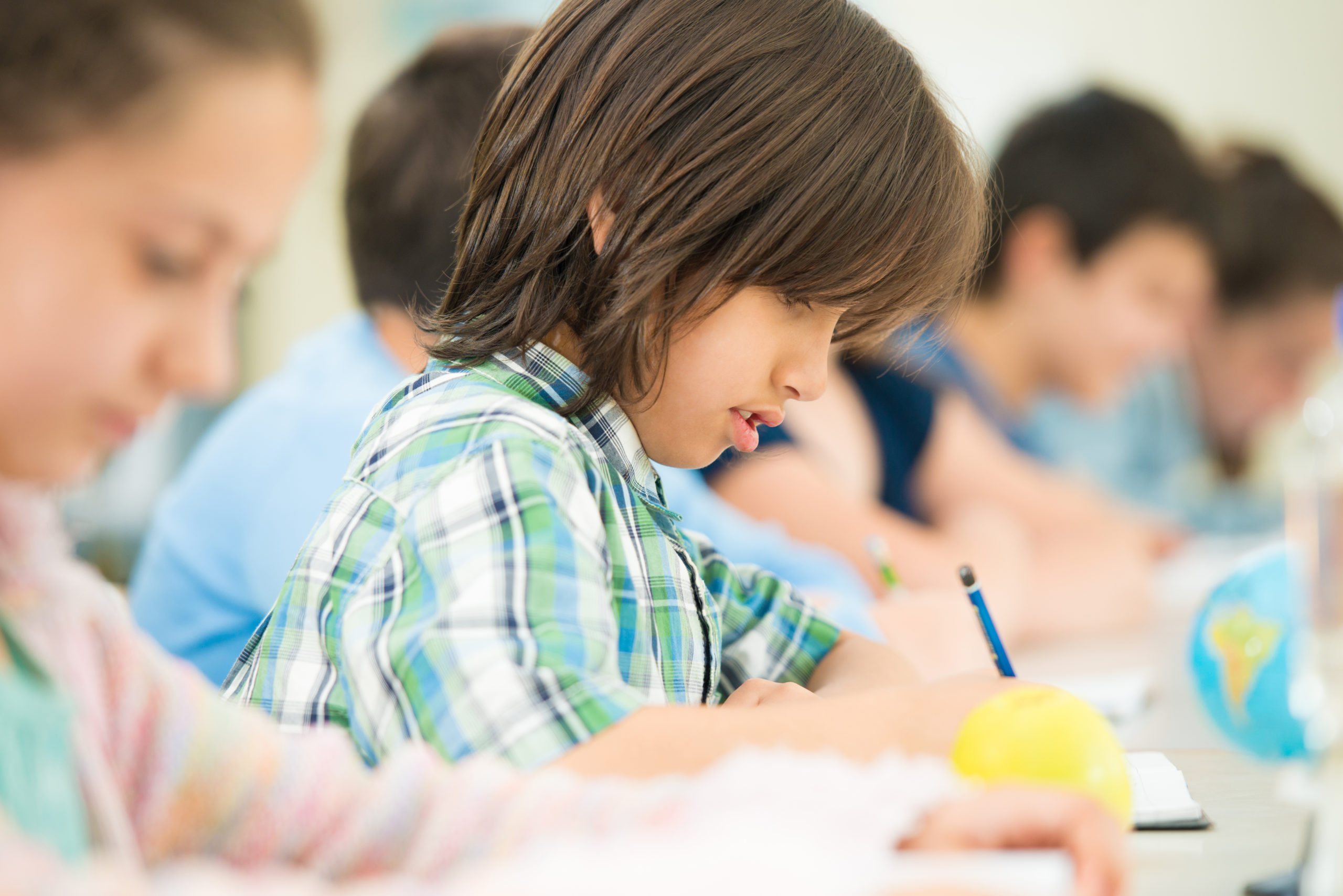 Happy Children Learning In School Classroom