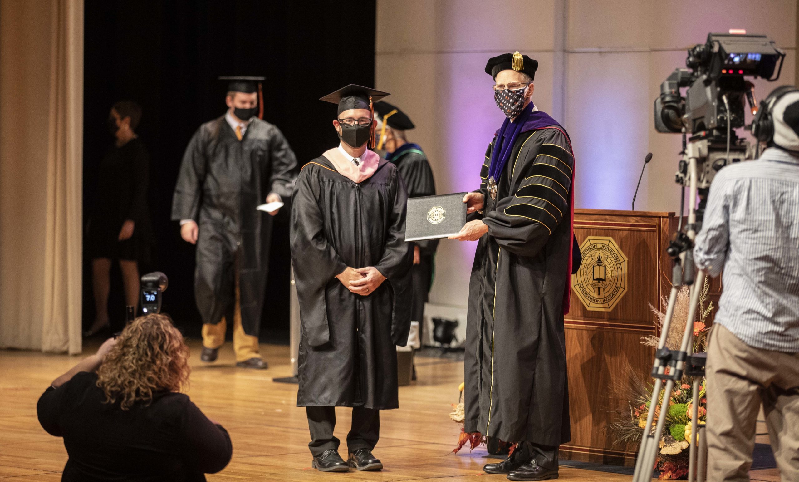 ARTY1704RG Student receives diploma during Commencement