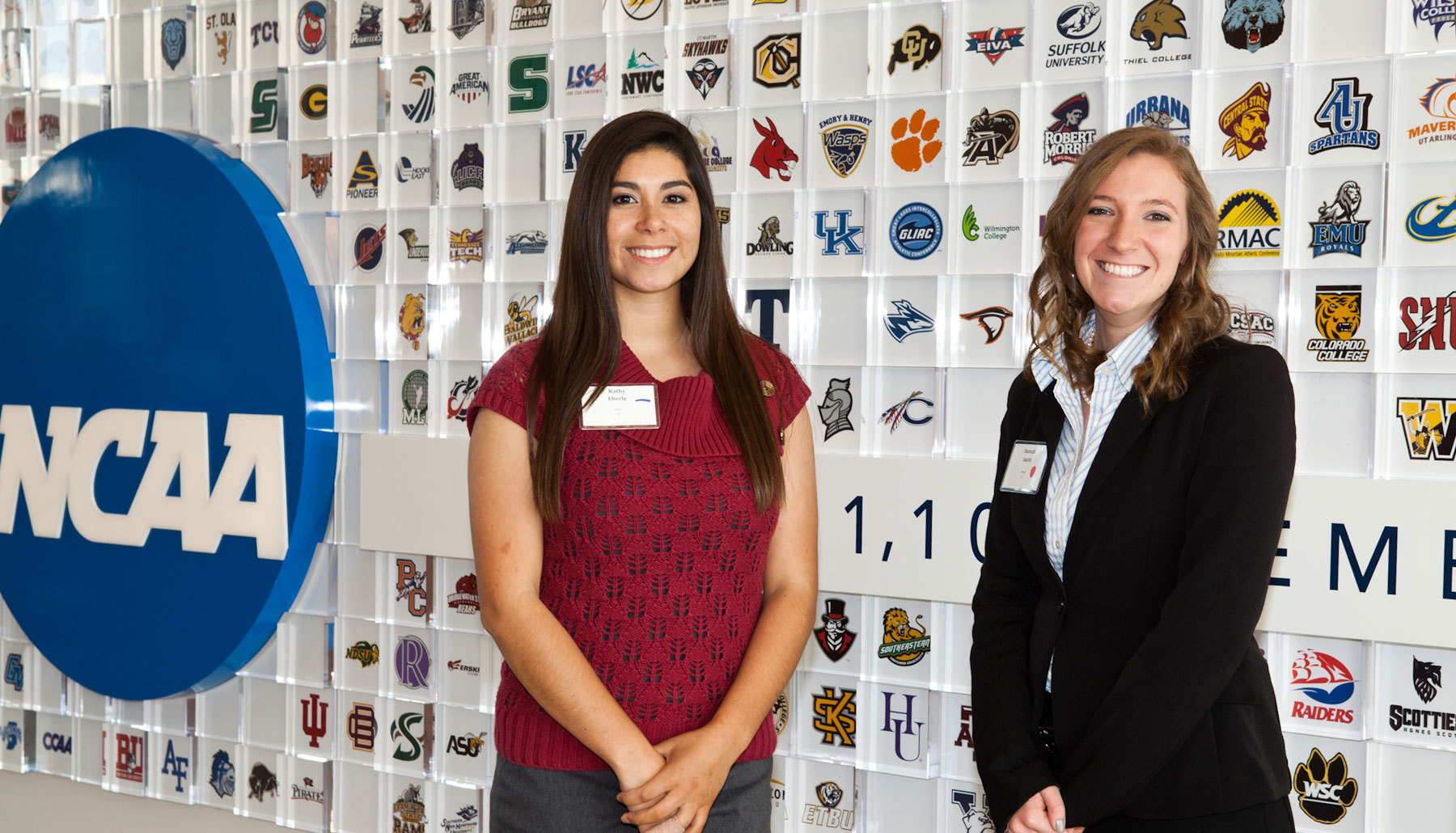 Busniess Students Two Girls HomePageBanner B a professor works with two students in the STAR trading room