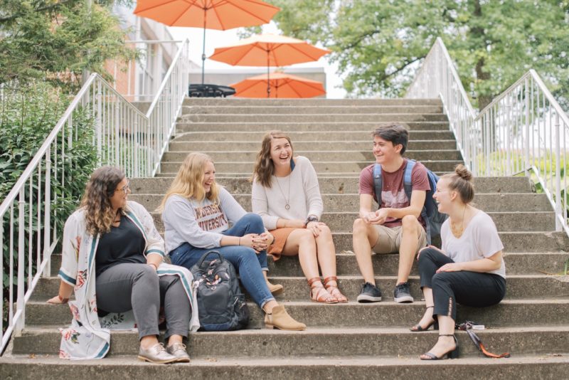 Five students on the steps of Olt student center