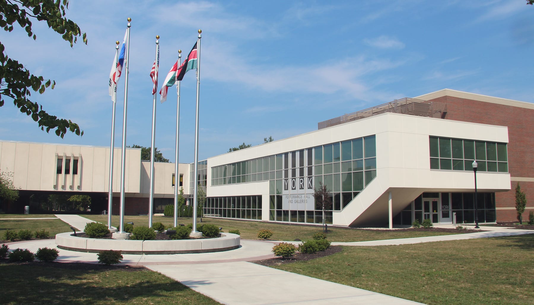 York Performance Hall with international flags in the foreground.