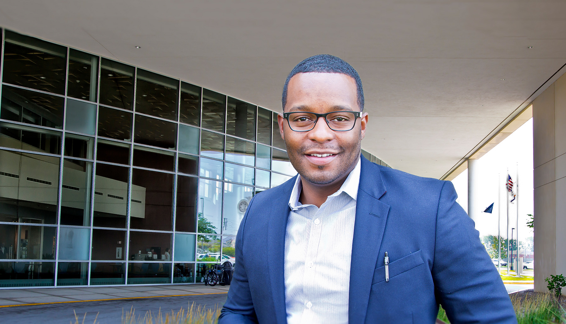 a black male student in glasses
