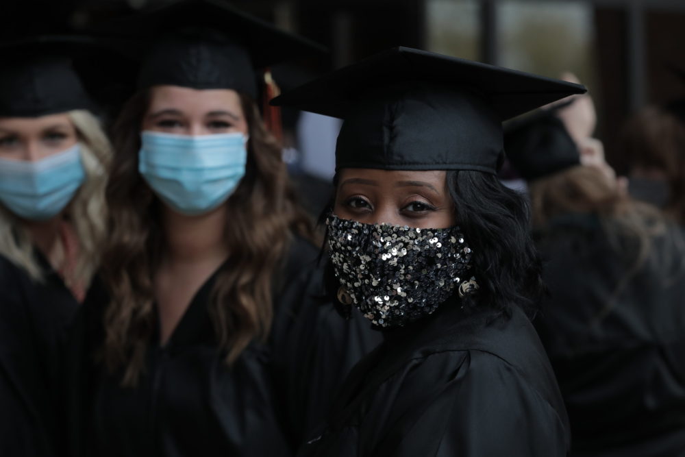 Graduate of Anderson University wearing glittery face mask.