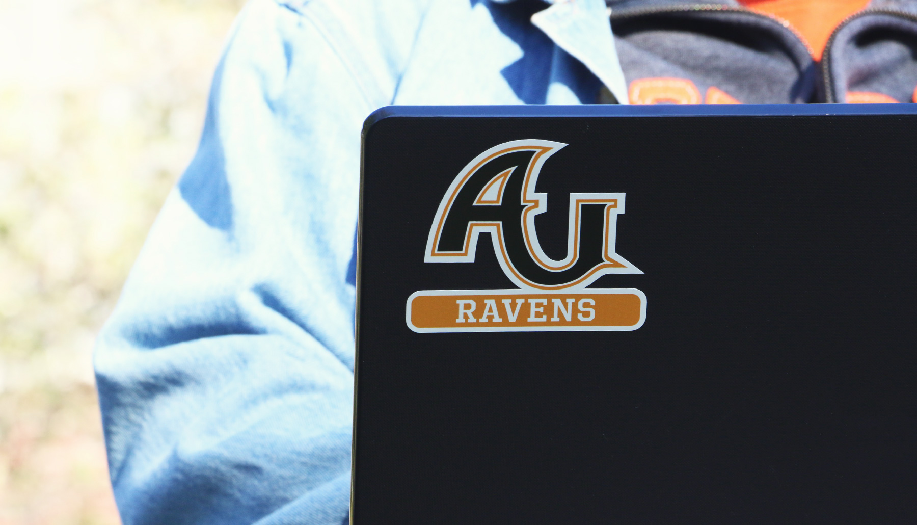 a laptop with an AU sticker on it