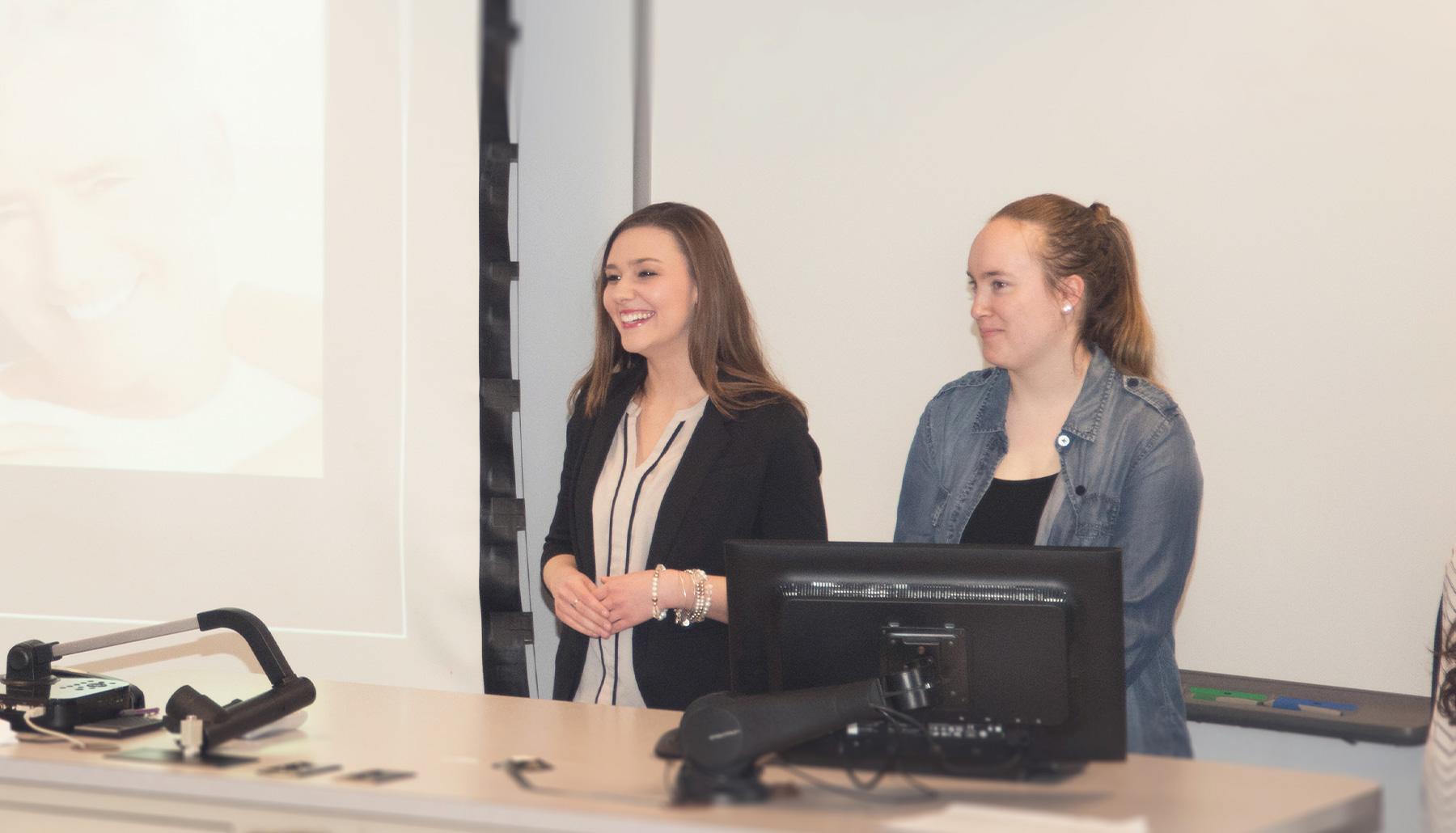 a female student talks with a female professor