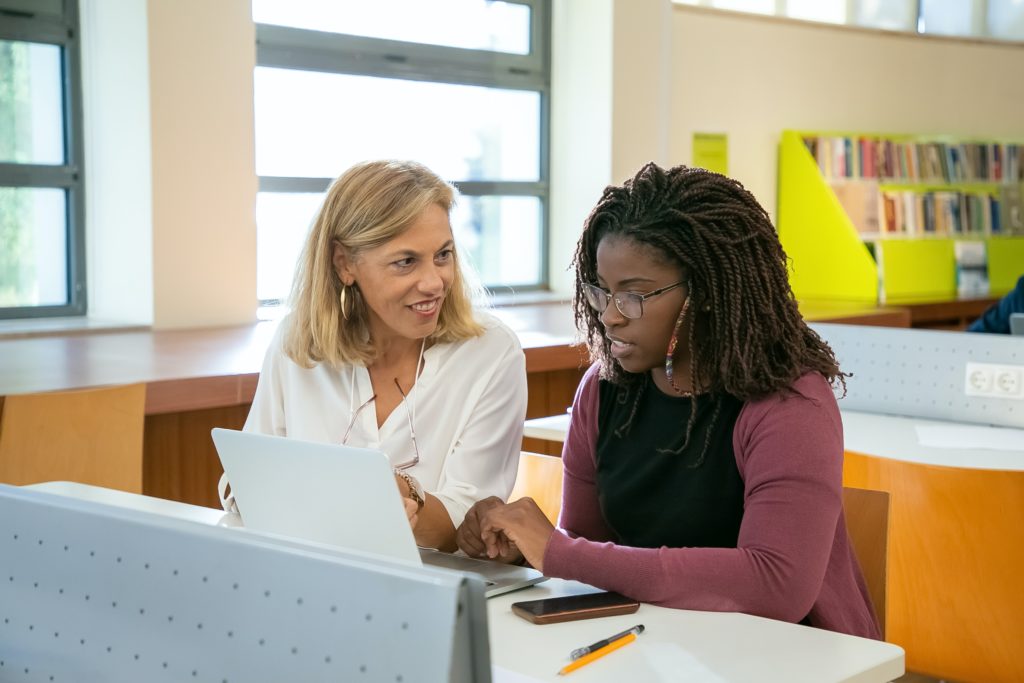 two female adult students studying