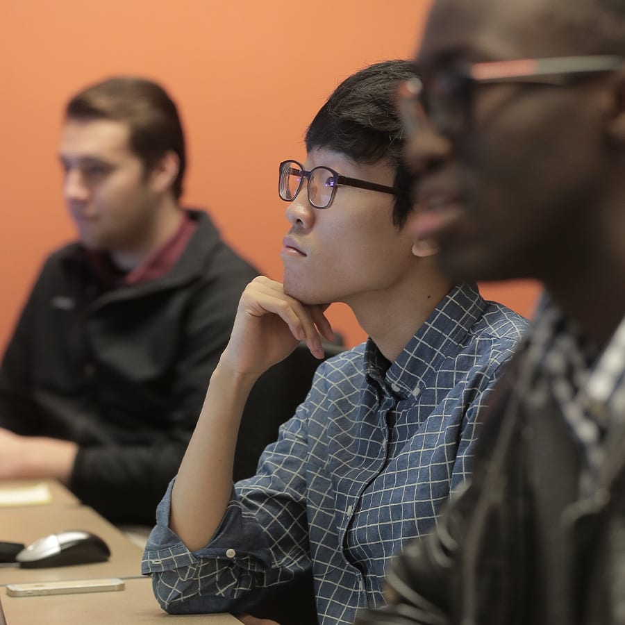 three students in the star trading room